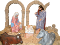 Portal de Betlem. Sant Josep, la Mare de Déu, el Nen Jesús viuen en un petit estable amb el bou i la mula